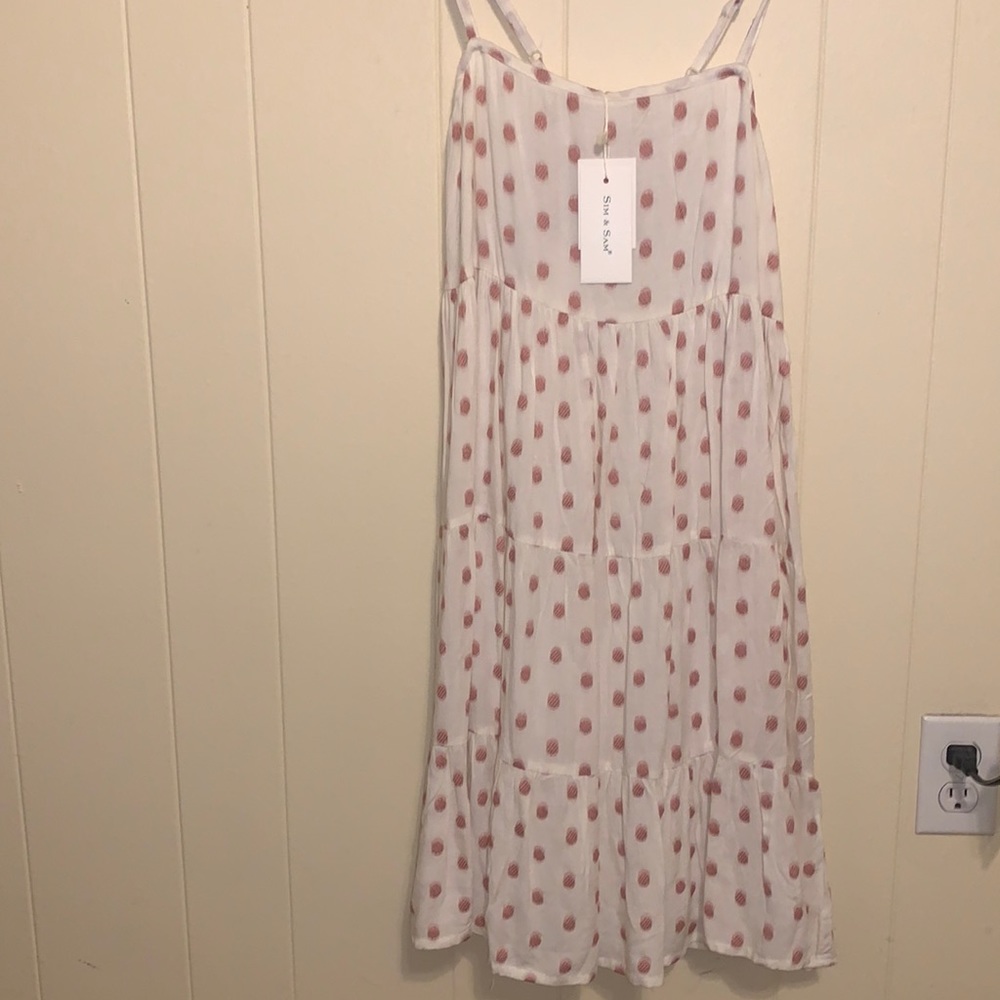 Beautiful white with pink Polk a dots. Stretch.